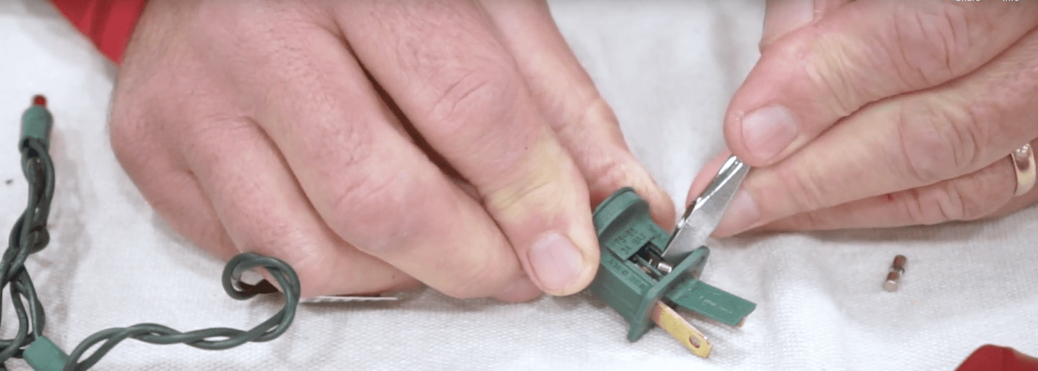 Use a screwdriver to push in new fuses.